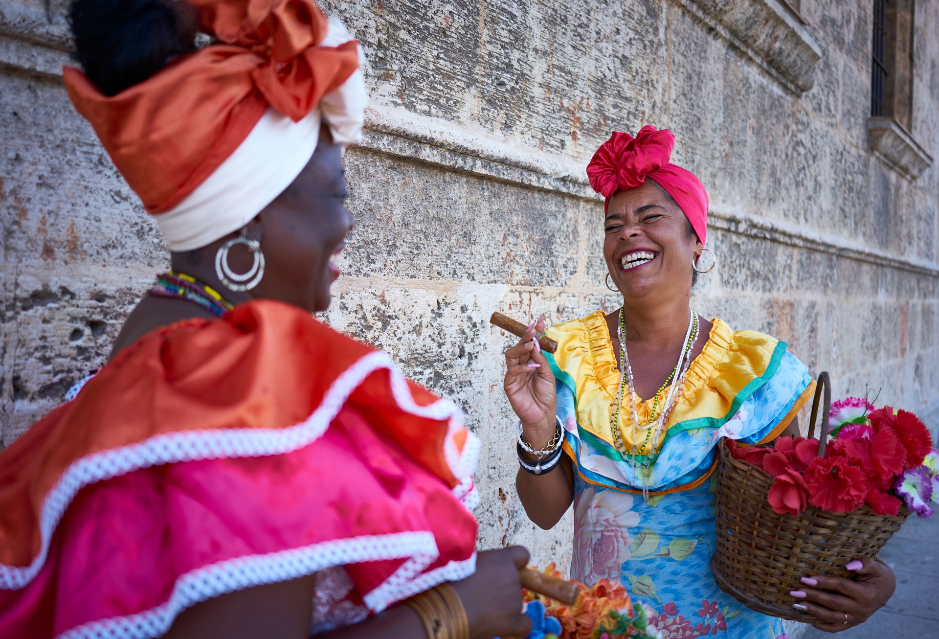 Two Cuban canasteras with habano flowers and typical costume